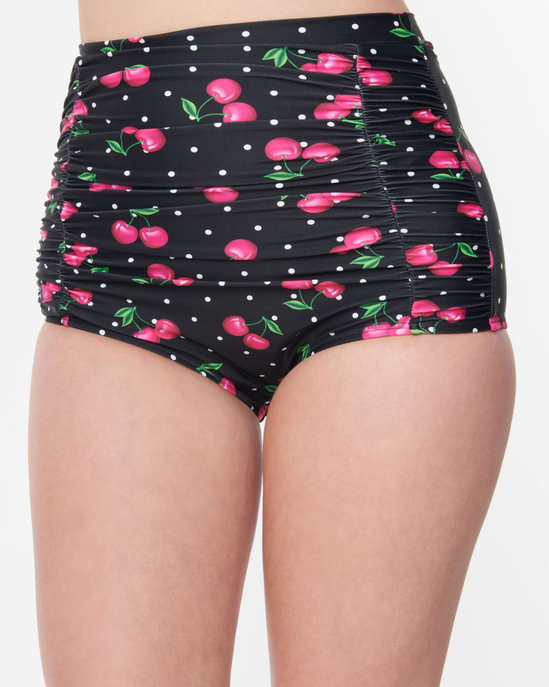 Front of a model wearing a size XL Unique Vintage Plus Size Black & Hot Pink Cherry Pin Dot Monroe Swim Bottom in Black & Hot Pink Cherry Pin Dot by Unique Vintage. | dia_product_style_image_id:287893